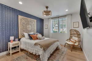 Bedroom featuring light wood-style flooring and recessed lighting