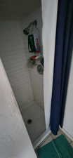 Bathroom featuring a stall shower and tile patterned floors