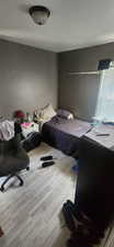 Bedroom with wood finished floors