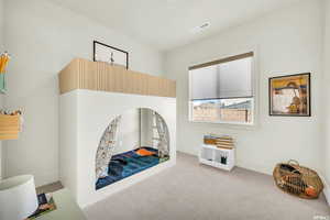 Interior space with carpet floors and baseboards