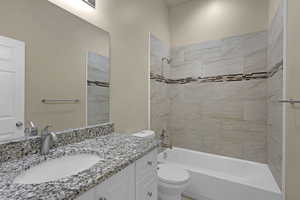 Bathroom featuring vanity and bathing tub / shower combination