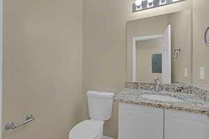 Bathroom with electric panel and vanity