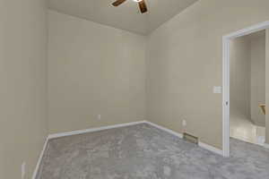 Unfurnished room featuring carpet and ceiling fan