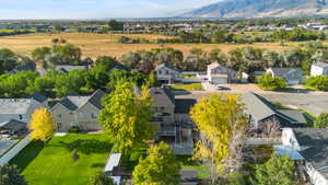 Aerial perspective of suburban area featuring a mountain backdrop