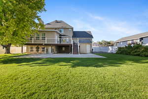 Back of house with a patio, stairs, a chimney, and a wooden deck
