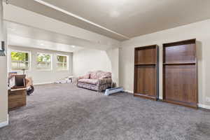 Living area with carpet floors and baseboards