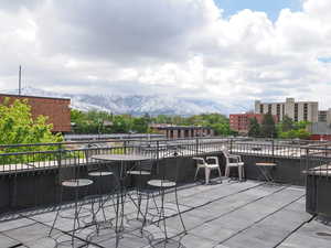 View of patio featuring a mountain view and a balcony