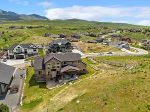 Aerial view of residential area featuring a mountainous background