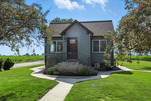 Bungalow-style home featuring a front yard