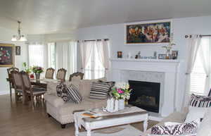 Living area featuring wood finished floors and a high end fireplace