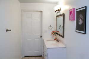 Bathroom with vanity and tile patterned flooring