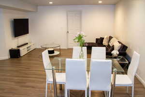 Dining area with recessed lighting and wood finished floors
