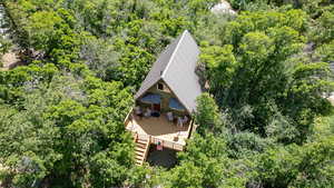 View of subject property featuring a heavily wooded area