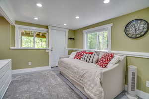 Bedroom with multiple windows and recessed lighting