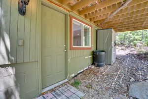 View of exterior entry featuring crawl space