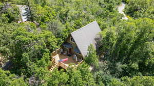 View of subject property featuring a heavily wooded area