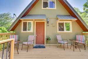 Exterior space with a deck and a metal roof