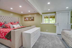 Bedroom featuring recessed lighting and concrete floors
