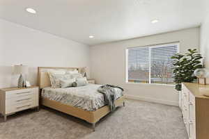 Bedroom featuring light colored carpet and recessed lighting