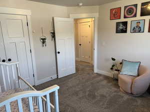 Bedroom with carpet floors and baseboards