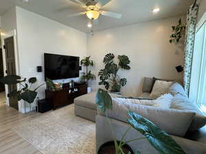 Living room featuring wood finished floors, a ceiling fan, and recessed lighting