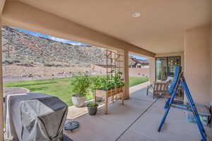 View of patio featuring grilling area and a mountain view