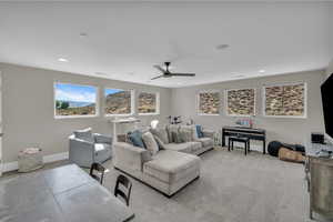 Living room with ceiling fan, carpet, and recessed lighting