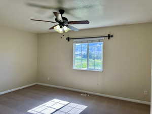 Nice-sized bedroom with fan and large window