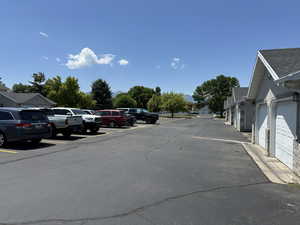 View of garage and the generous amount of parking