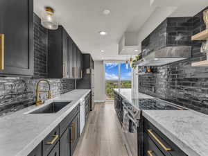 Sleek black kitchen with gold finishes