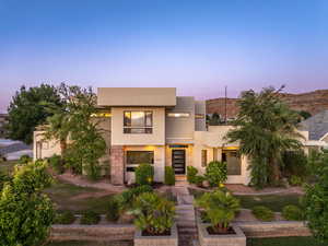 Contemporary house featuring stucco siding