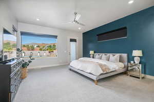Carpeted bedroom with recessed lighting and ceiling fan