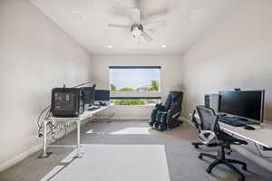 Carpeted home office featuring ceiling fan and recessed lighting
