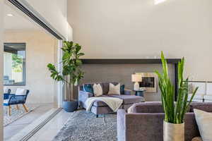 Living room featuring light tile patterned floors and recessed lighting