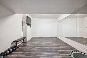Walk in closet featuring wood finished floors