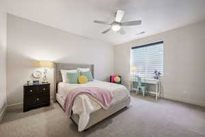 Carpeted bedroom featuring baseboards and a ceiling fan