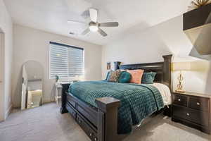 Bedroom featuring carpet flooring and a ceiling fan