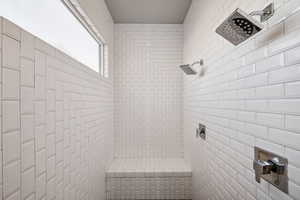 Full bathroom with a tile shower