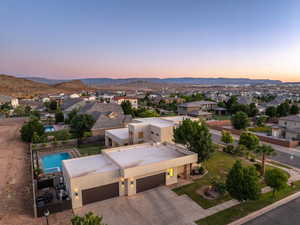 Aerial view of residential area featuring a mountainous background