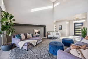 Living room with a chandelier and a high ceiling