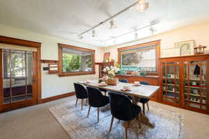 Dining area with gumwood accents and built in original cabinetry