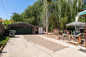 Detached oversized, 2 car garage and area off garage used as enclosed bistro area