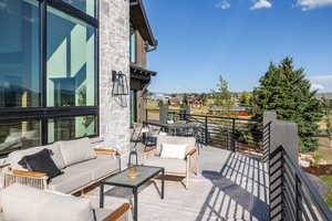 View of patio with an outdoor hangout area