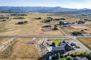 Aerial view of sparsely populated area with a mountain backdrop