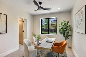 Home office featuring carpet flooring, a ceiling fan, and recessed lighting