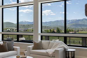 Sunroom featuring a mountain view