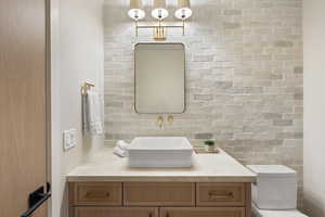 Bathroom featuring vanity and toilet