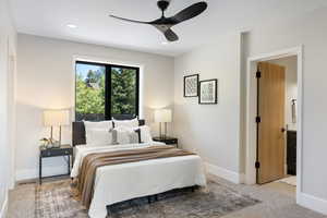 Bedroom featuring light colored carpet, recessed lighting, ceiling fan, and ensuite bathroom