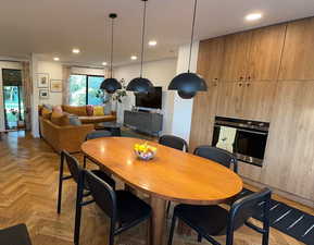 Dining space featuring recessed lighting
