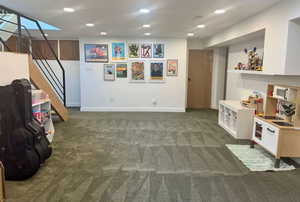 Playroom with carpet floors and recessed lighting